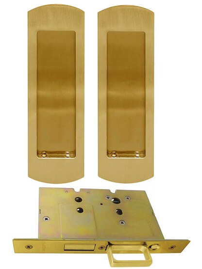 Premium Dummy Pocket-Door Mortise Lock Set with Rounded Pulls in Aged Brass.